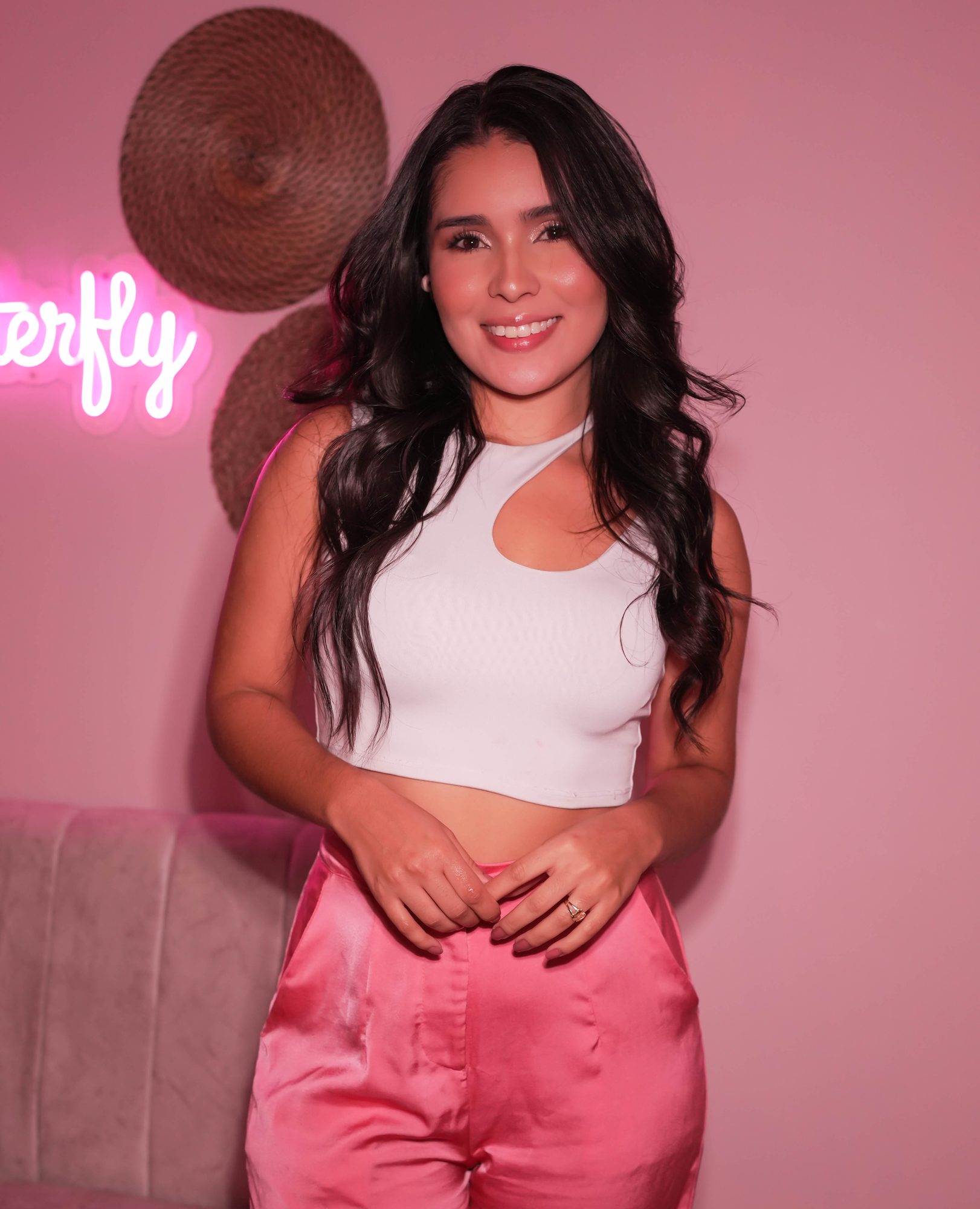 Creator portrait session on pink neon wall