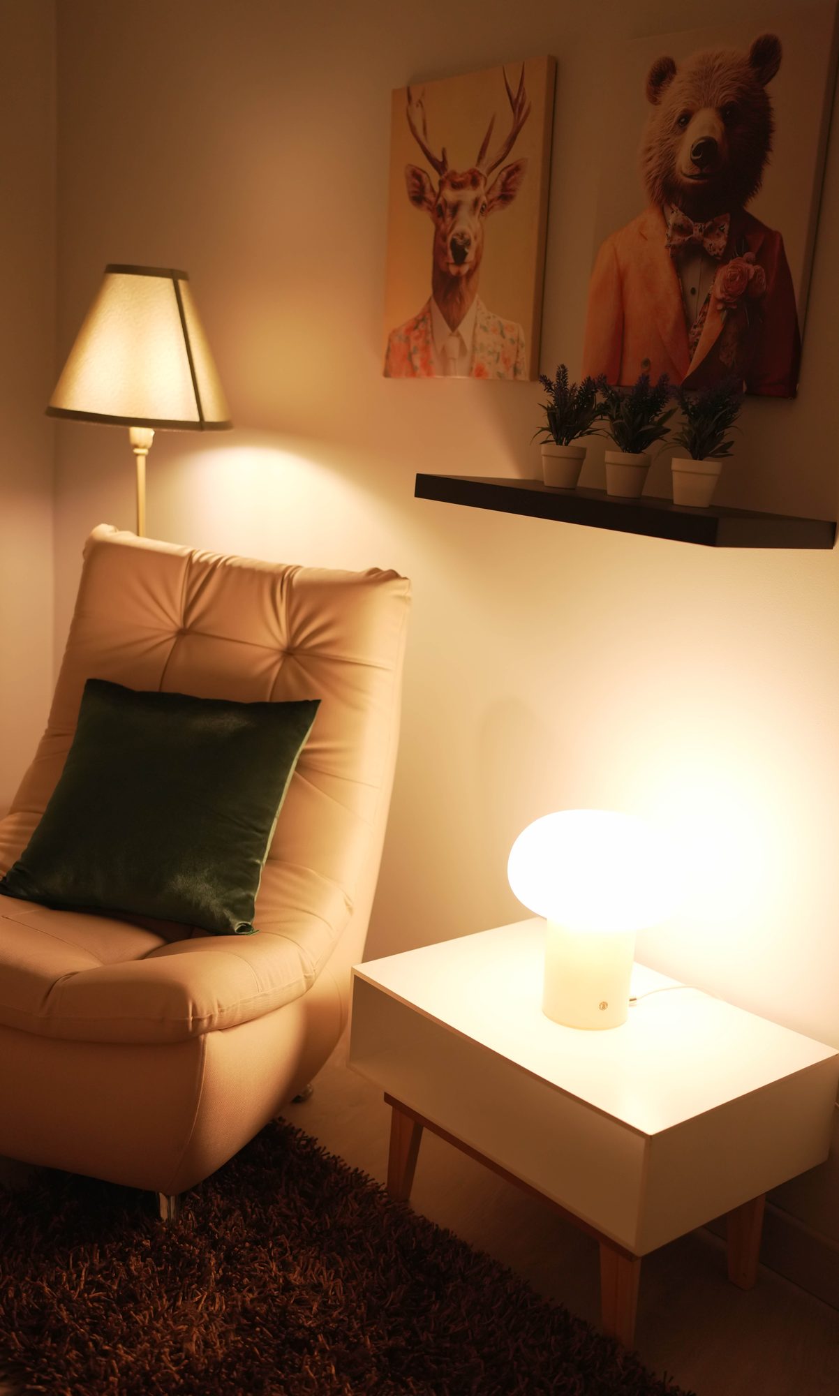 Amber-lit armchair set with side table and artwork