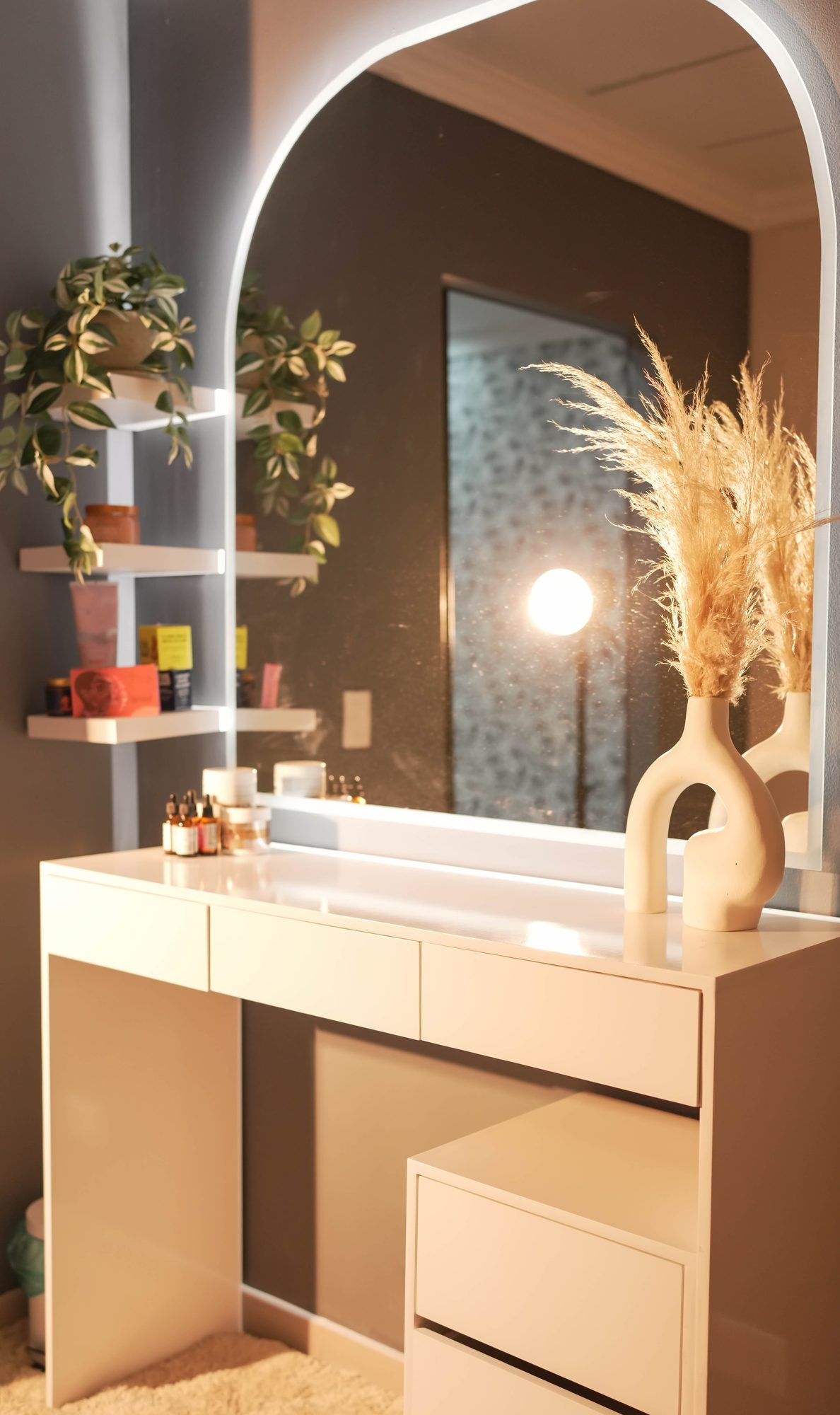 LED-lit beauty vanity with arched mirror
